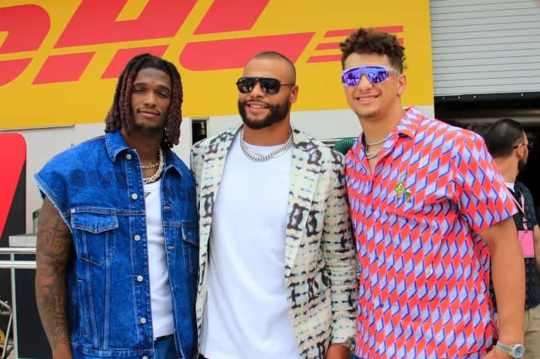 May 7, Miami Gardens, Florida: Before the Formula 1 Crypto.com Miami Grand Prix at Miami International Autodrome, quarterbacks Patrick Mahomes of the Kansas City Chiefs and Dak Prescott of the Dallas Cowboys converse. (Image courtesy of Getty Images via Jeff Robinson/Icon Sportswire))